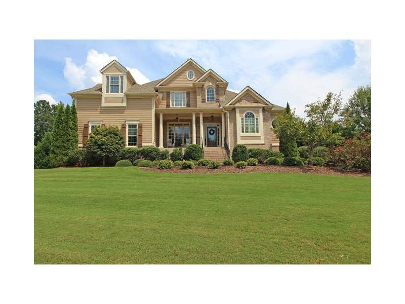 GORGEOUS CUSTOM HOME ON .8 ACRE LOT FEATURING A GO