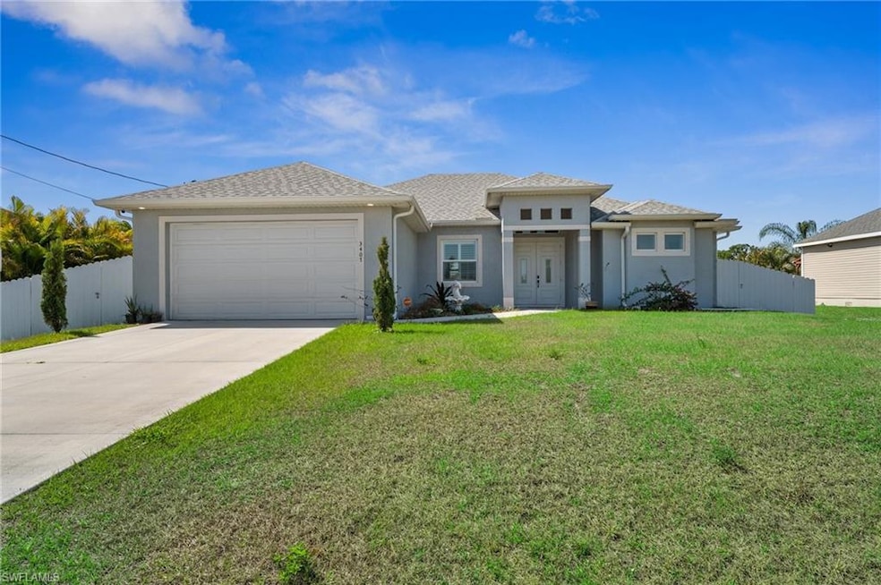 Ranch-style house with a front yard, an attached g
