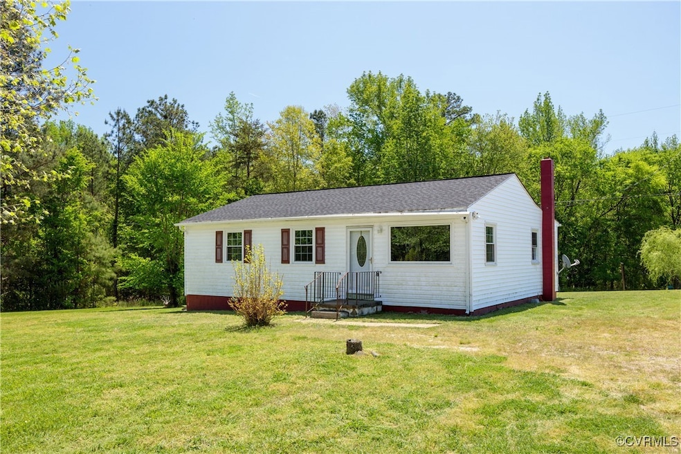 View of front of property with a chimney and a fro