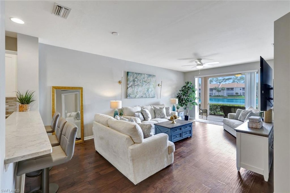 Living great room featuring breakfast/lunch bar, a