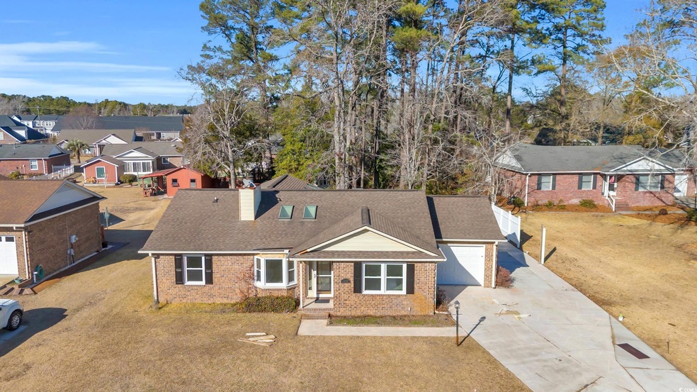View of front of property with a garage and a fron