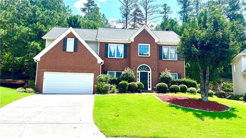 View of front of home featuring a garage and a fro