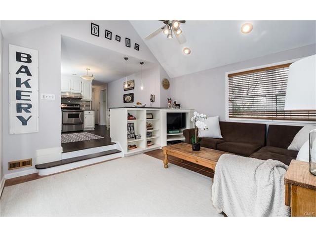 Vaulted family room with built-ins, doors to rear 