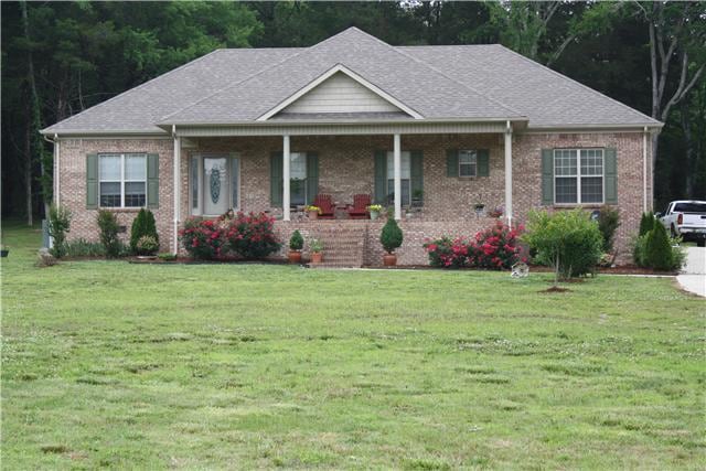 Front View of Home - This home is anxiously awaiting new owners with it's welcoming front porch and gorgeous landscaping.