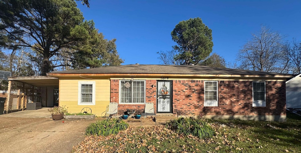 View of front facade with a carport