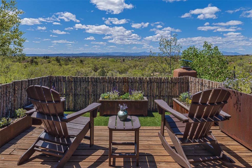 Private Coyote-fenced deck with irrigated planters & vast panorama
