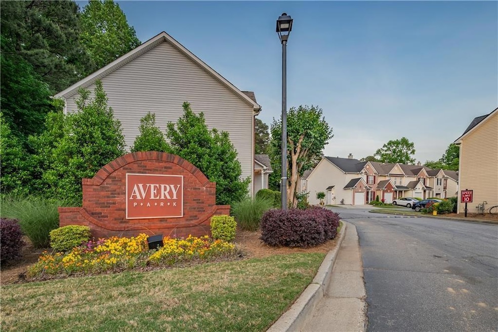 Community / neighborhood sign featuring a residential view