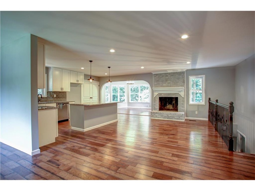 The open concept kitchen and great room just screa