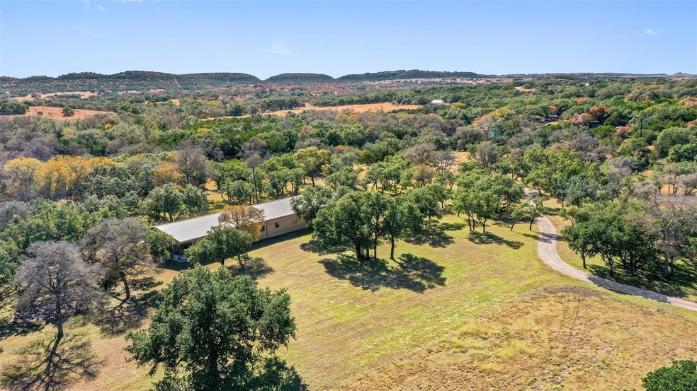 Drone / aerial view featuring a view of trees