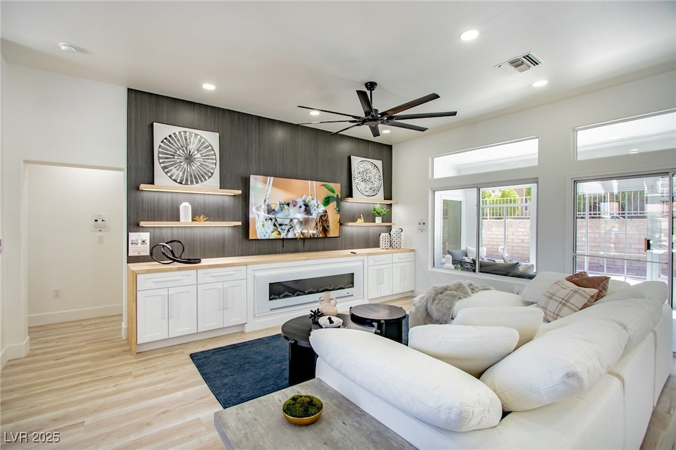 Living room with light wood-type flooring, recesse