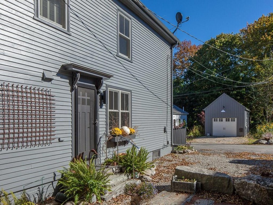 Side entrance with garage across the...