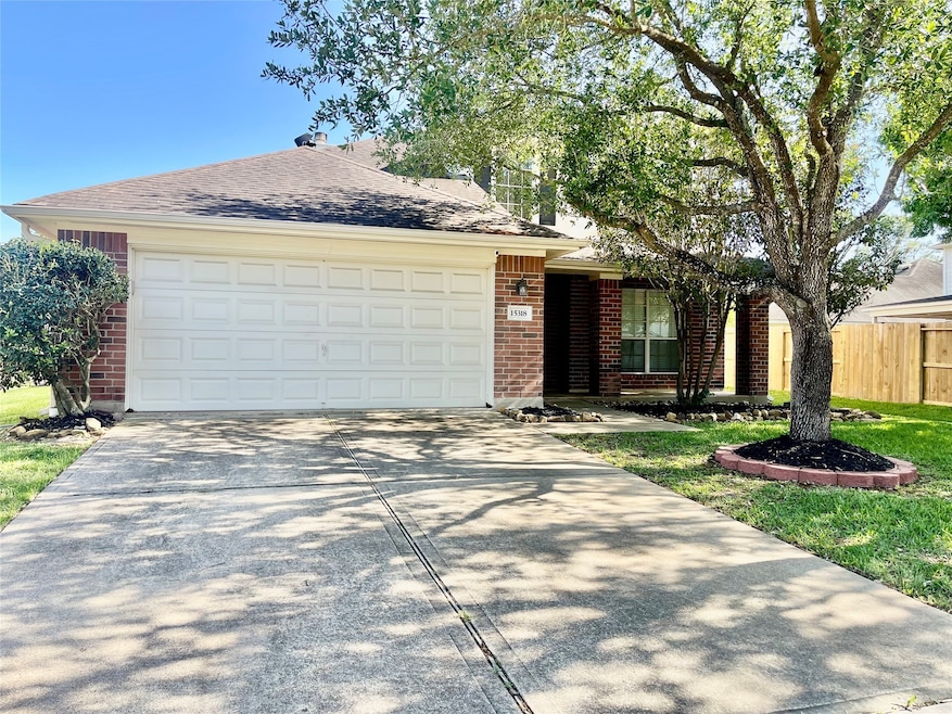 Charming single-story brick home with a two-car ga