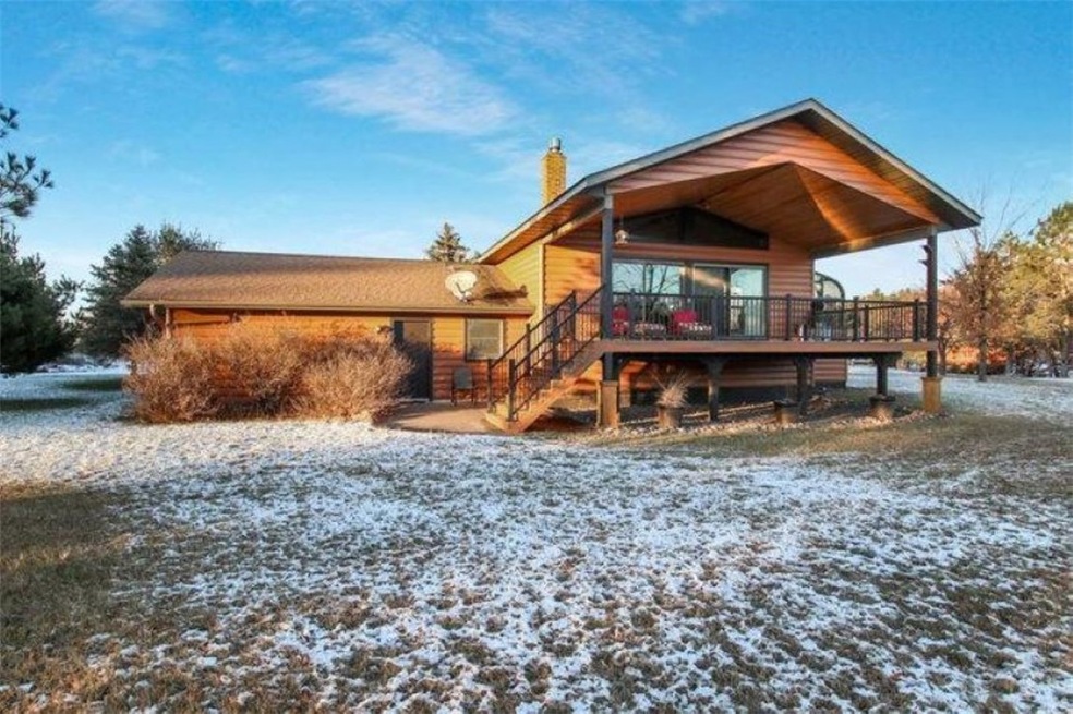 The time of year does not due the home photos justice. Notice the exterior is nearly all maintenance free? There is textured steel siding and composite decking to retain the fresh new exterior finish. Home is nestled on over an acre ( a double lot).