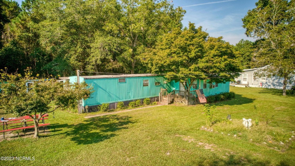 .35 acres of land + manufactured home