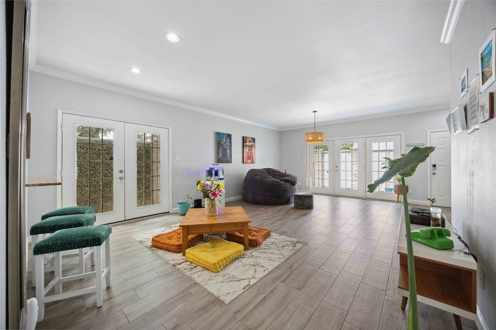 Spacious living/dining area with abundance of natu