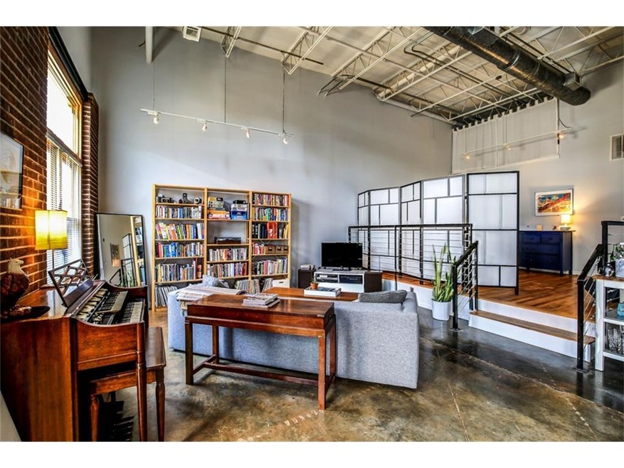 THIS AUTHENTIC INDUSTRIAL LOFT OFFERS SOARING CEIL