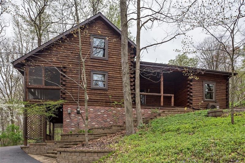 Custom built Log home nestled on 10.4 acres.  Orig