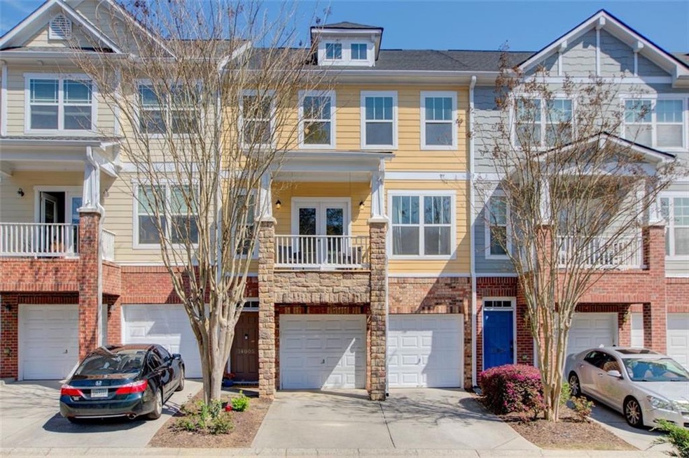 Front view of townhome with 2 car garage
