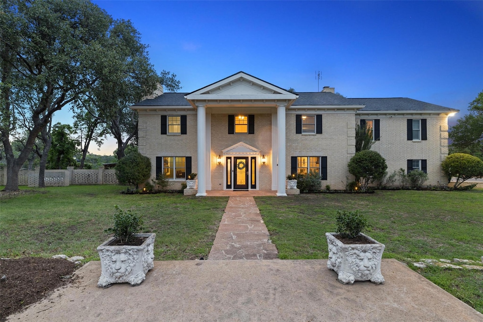 Greek revival inspired property with a chimney an