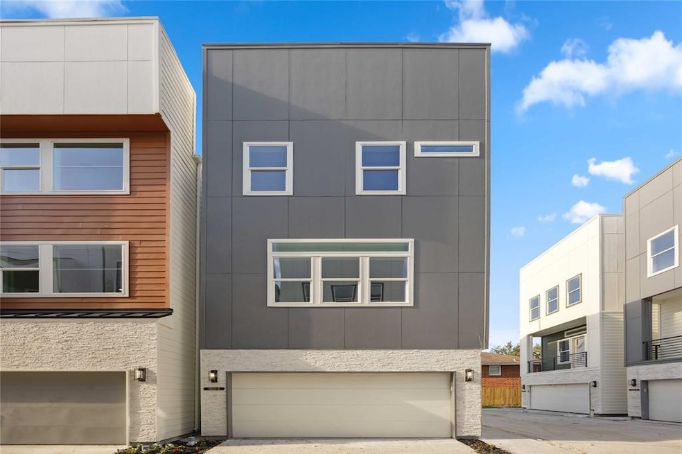 Modern brand new, three-story home with a sleek de