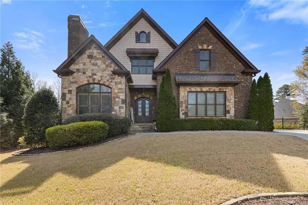 Exquisite stone, brick and shaker shingle home