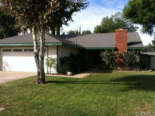 Front of house, faces East.