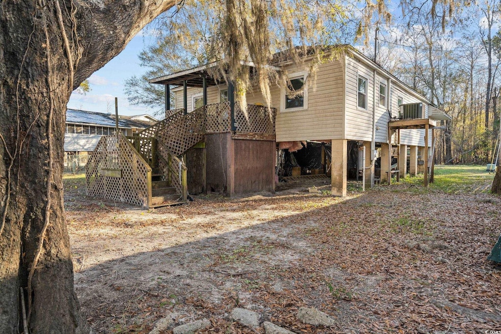 View of side of property with central air conditio