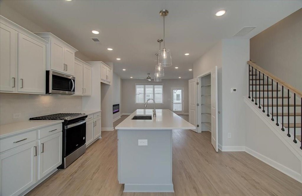 The kitchen is the anchor of the main level and has plenty of space for large gatherings.