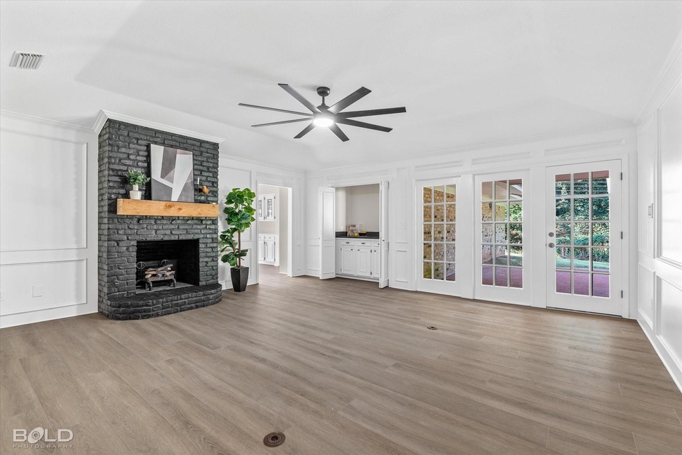 Unfurnished living room with crown molding, ceilin