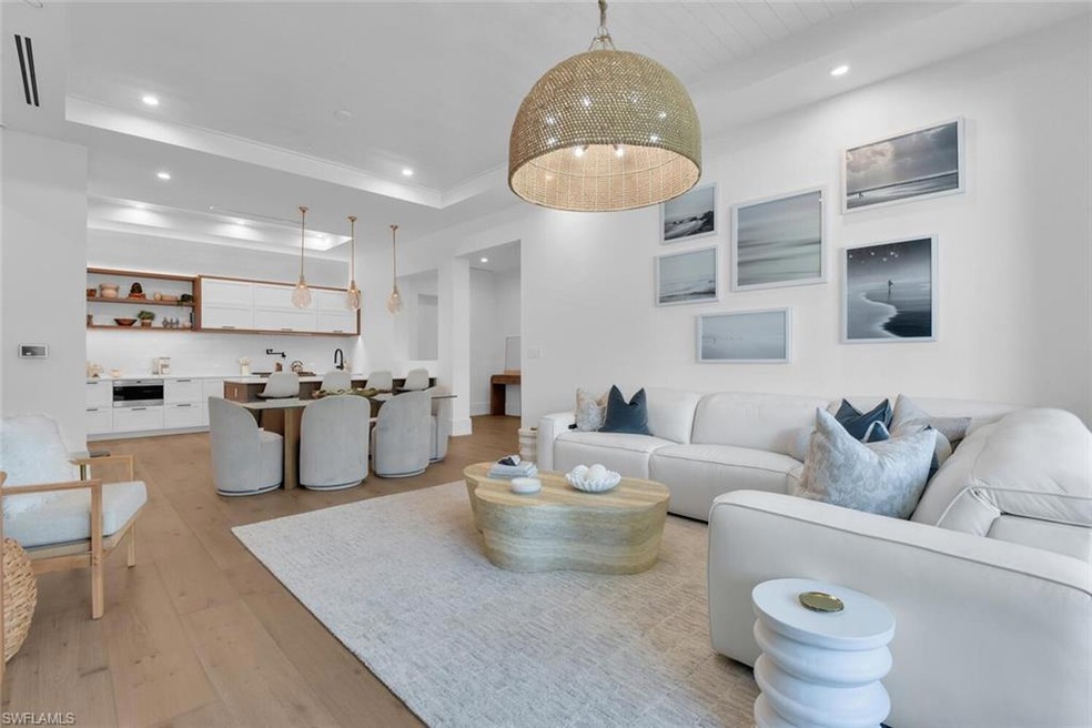 Living room with recessed lighting, light wood fin