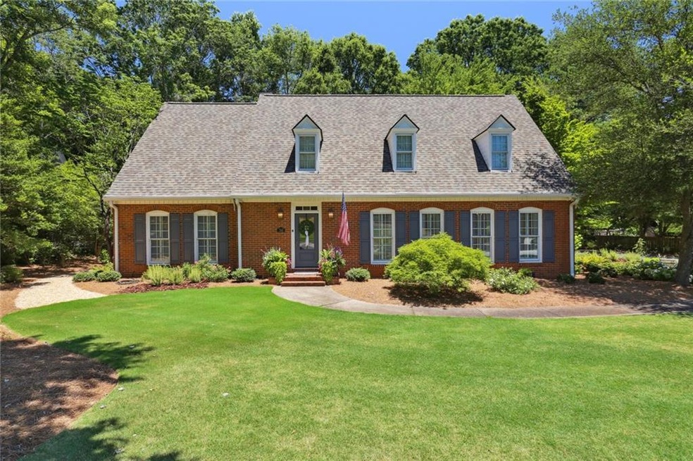 Traditional style home with a front lawn