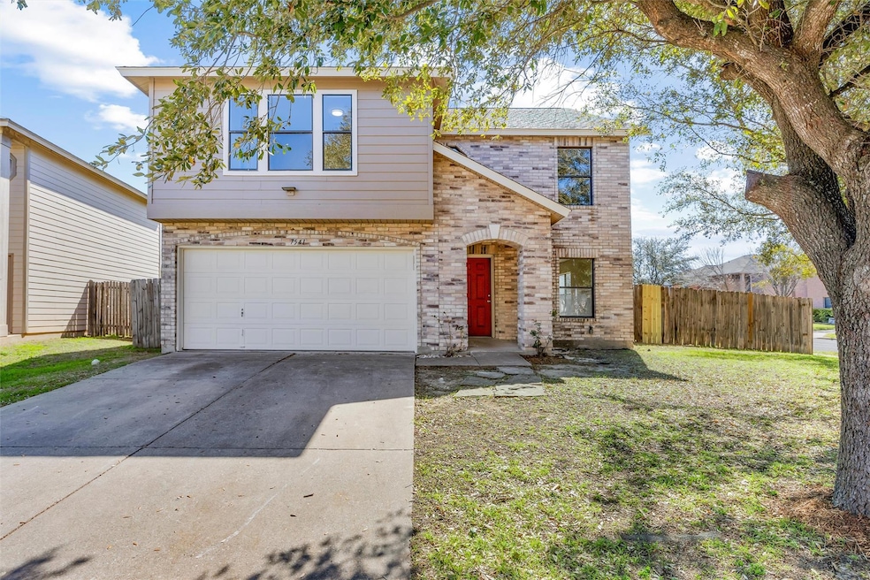 View of front of property featuring concrete driv