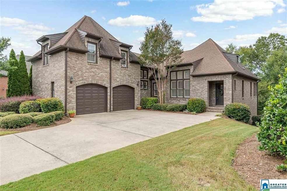 This full brick home is located behind the gate in