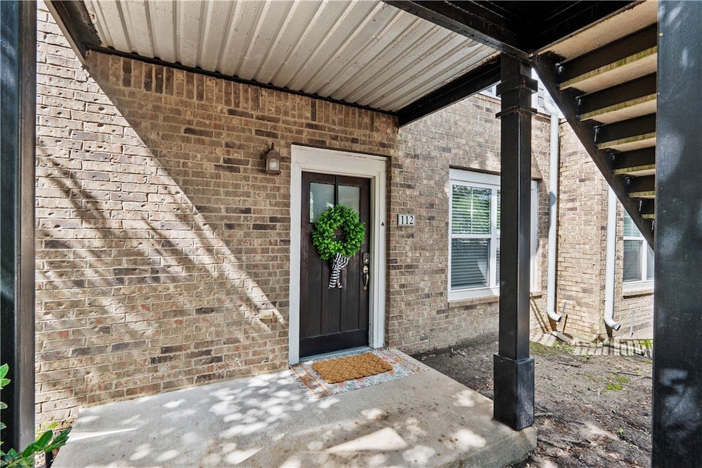 Doorway to property with brick siding