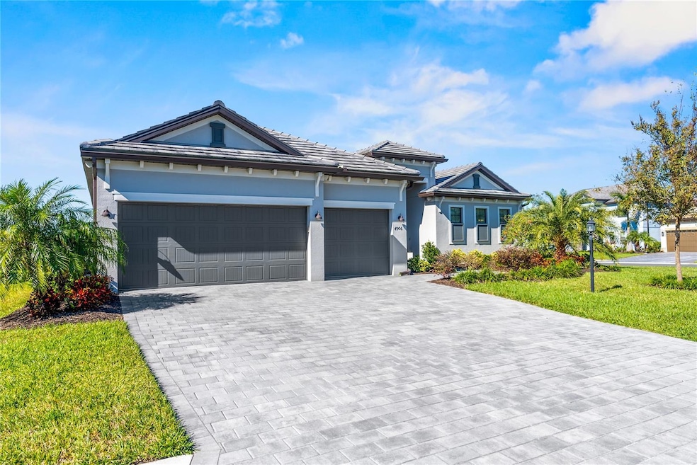 Full paver driveway precedes the spacious insulated and Air Conditioned 3-Car Garage