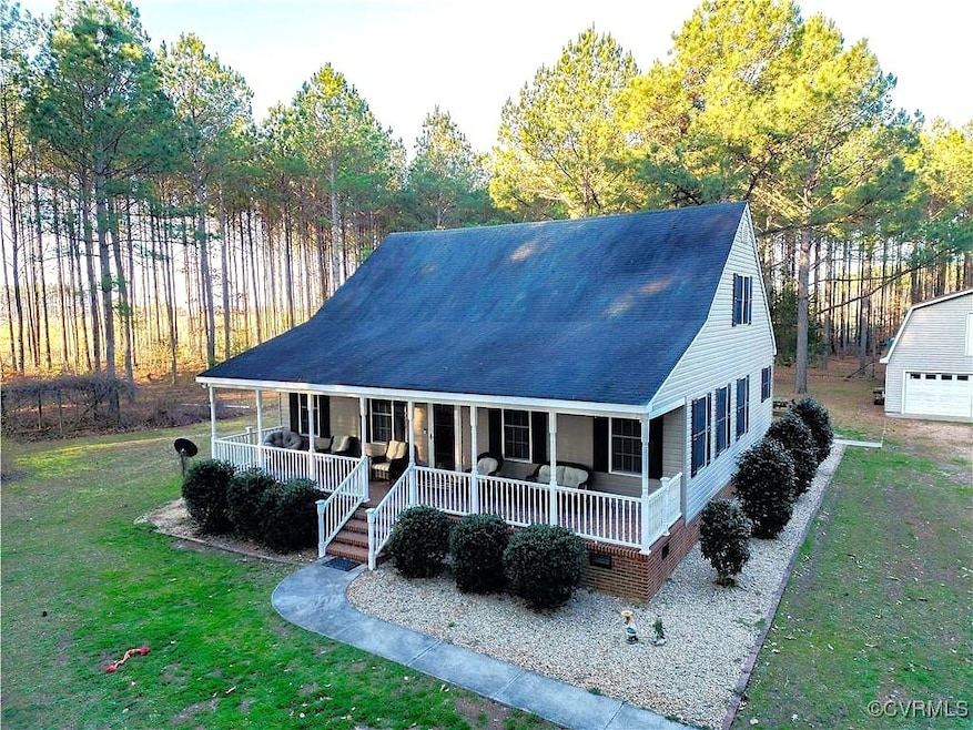 View of front facade with a front yard, a porch, a