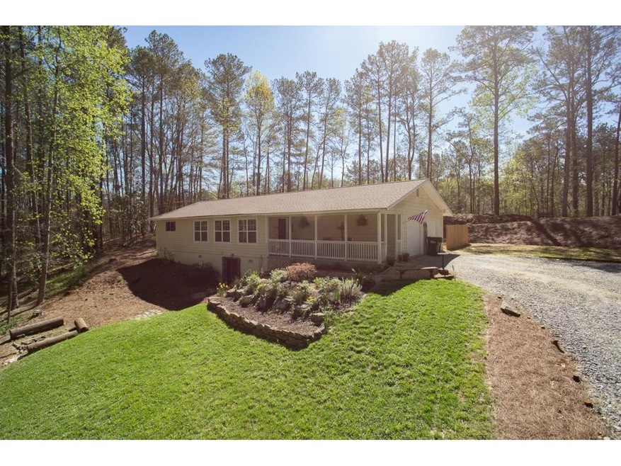 Nice long driveway leading to a porch you can sit 