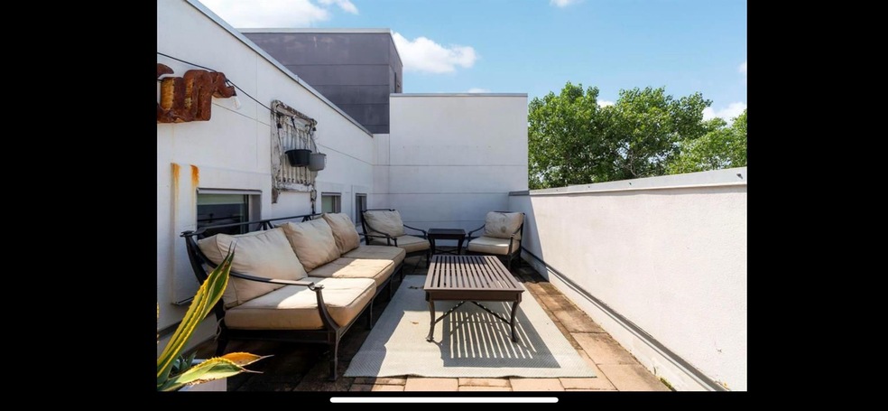 Balcony featuring a patio area and an outdoor han