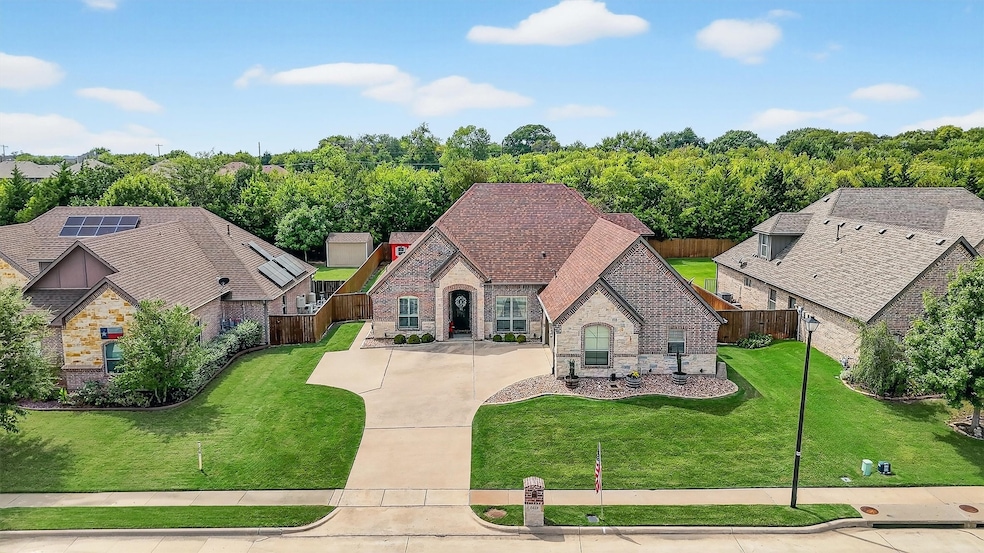 View of front facade featuring stone siding and brick siding