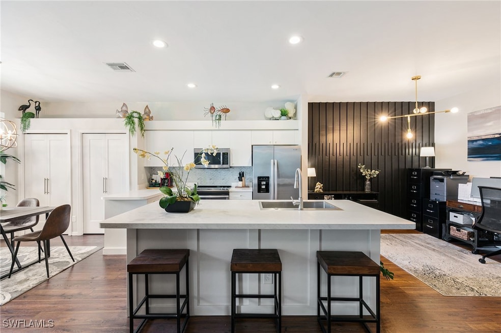Kitchen with visible vents, appliances with stainl