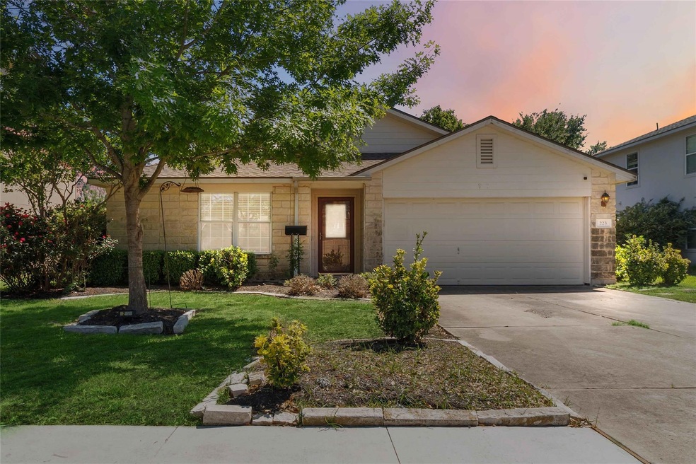 View of front of property featuring an attached g