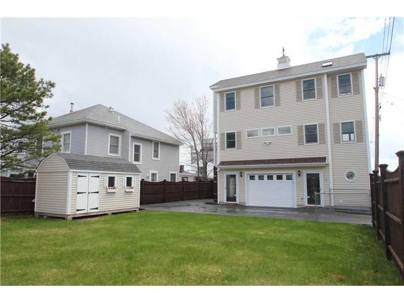 Exterior. Fenced in yard features a...