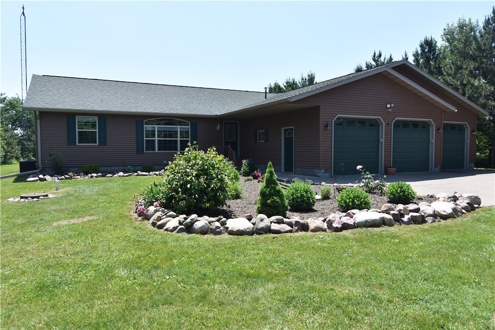 Front Of Home with beautiful rock landscaping and