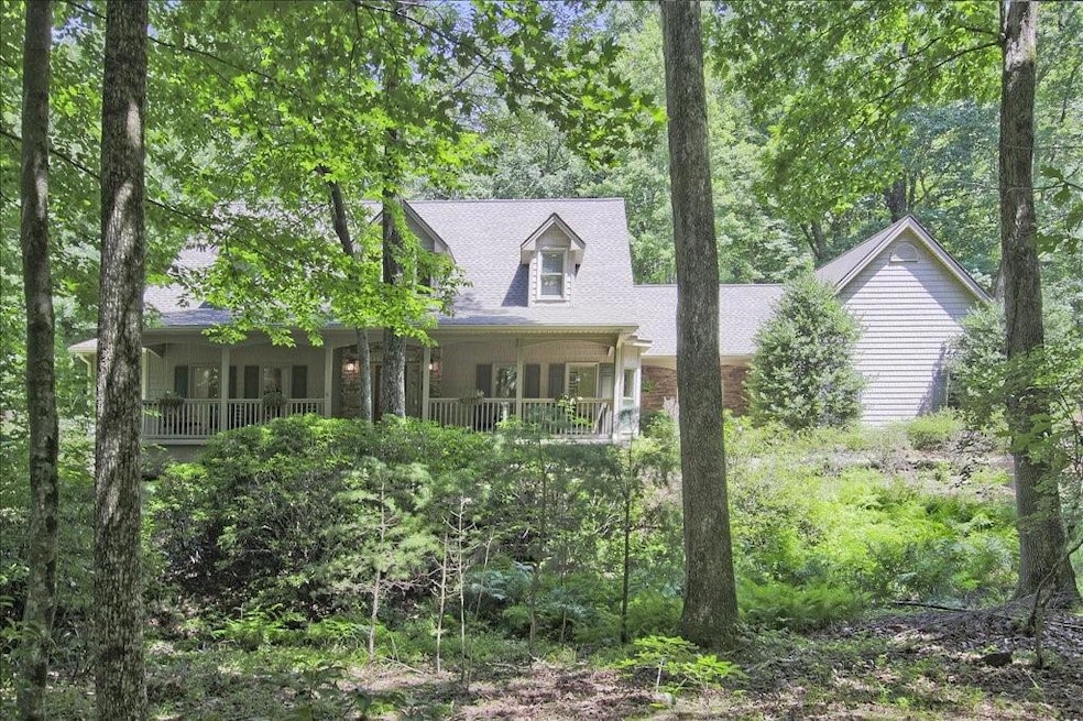 Beautiful home in the woods with a waterfall creek in your back yard