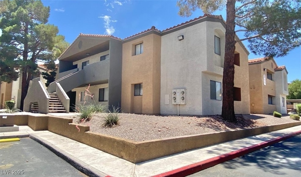 View of property featuring stairway