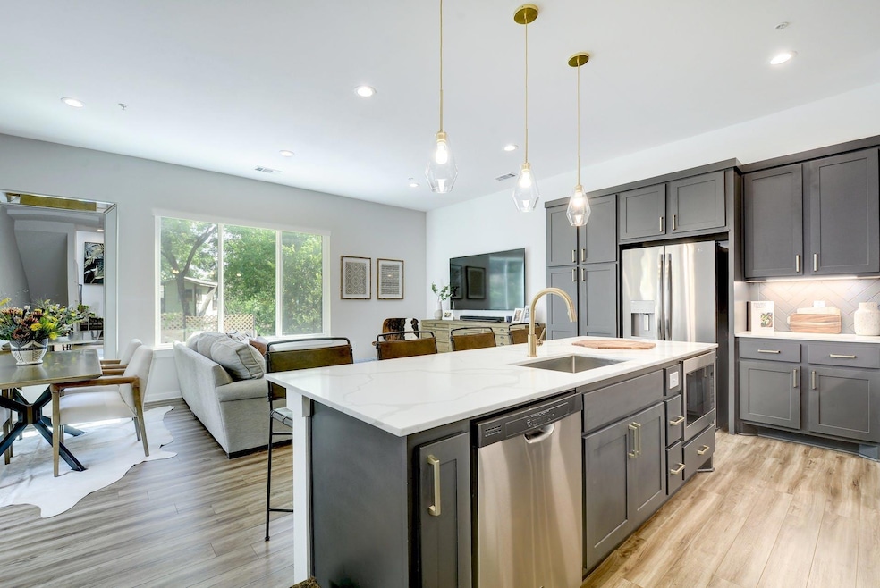 Bright, open-concept main living area with 10-foot ceilings, large windows, and natural light.