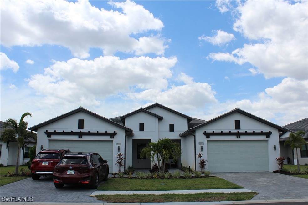 Single story home featuring an attached garage, st