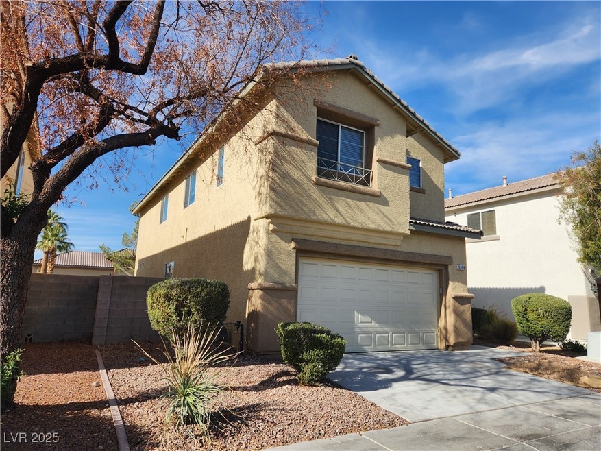 View of front of home with concrete driveway, fenc