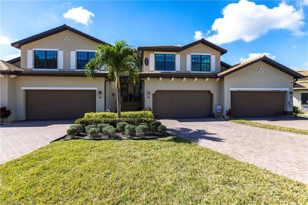 View of front of property featuring a garage and a
