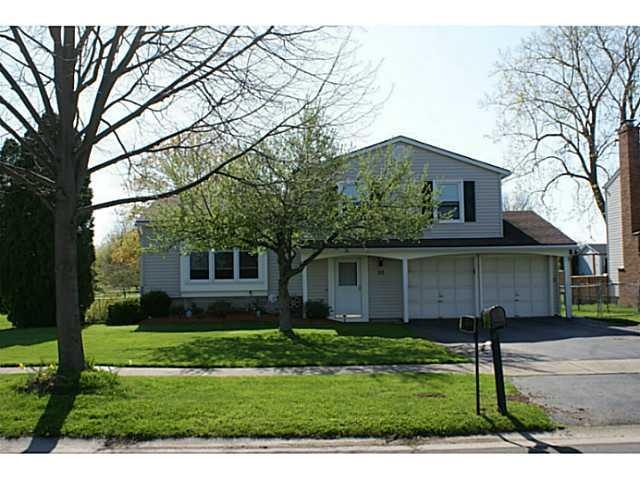 Exterior Front. Lovely yard is the perfect setting